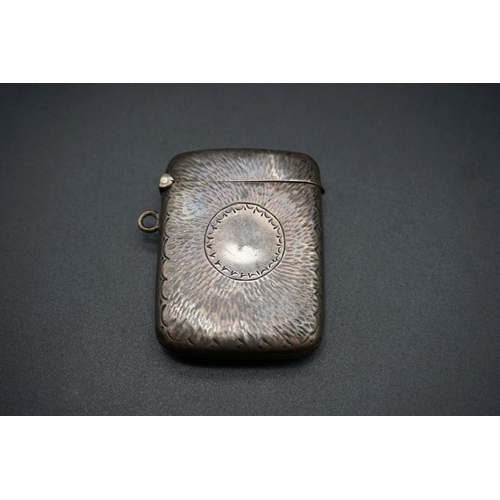 614 - A small group of silver and white metal items, to include a silver vesta case. (9)