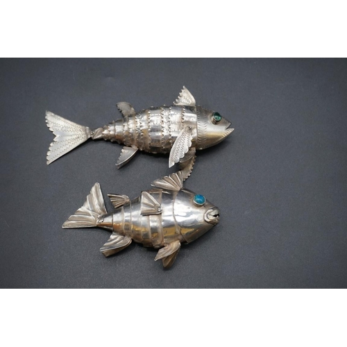 616 - Two white metal articulated fishes, largest 12.5cm long.