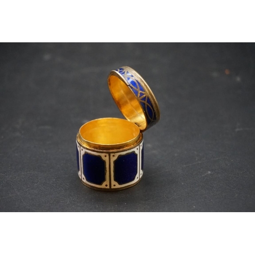 618 - A gilt metal and enamel cylindrical box, 32mm high; together with a small quantity of silver items; ... 