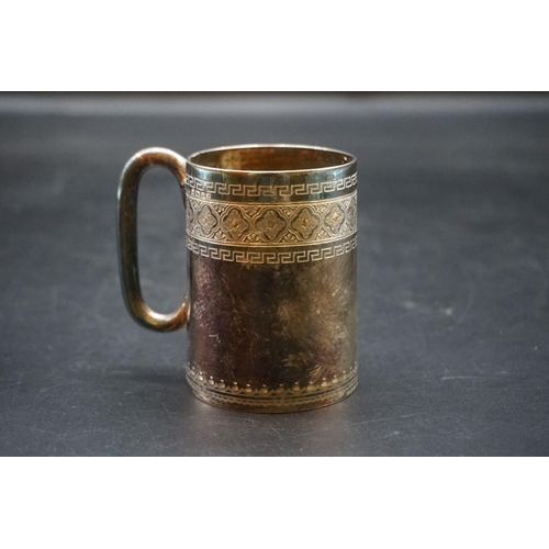 621 - An Eastern white metal mug; together with a Dimple whisky miniature bottle; and small silver pin dis... 