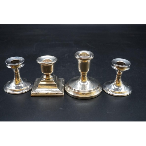 634 - A pair of silver circular dwarf candlesticks; together with two other silver dwarf candlesticks. (4)... 