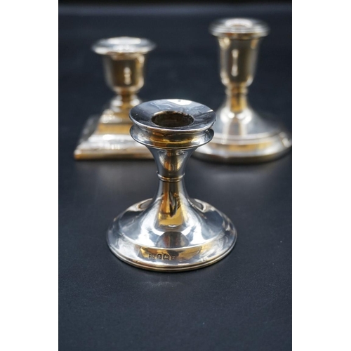 634 - A pair of silver circular dwarf candlesticks; together with two other silver dwarf candlesticks. (4)... 