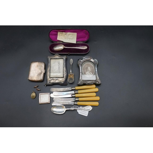 638 - A Victorian cased silver christening spoon; together with a silver cigarette case; a .800 sugar shov... 