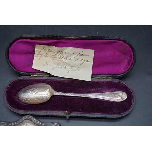 638 - A Victorian cased silver christening spoon; together with a silver cigarette case; a .800 sugar shov... 