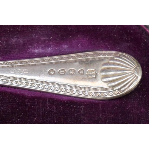 638 - A Victorian cased silver christening spoon; together with a silver cigarette case; a .800 sugar shov... 