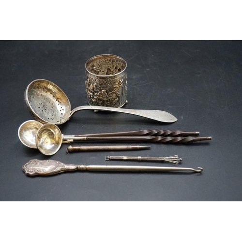 639 - A quantity of white metal and other metal items, to include; a continental sifter ladle; two baleen ... 