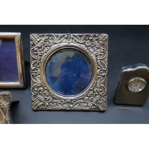 640 - Four silver photograph frames, largest 20 x 16.cm; together with a silver easel clock, by R Carr. (5... 