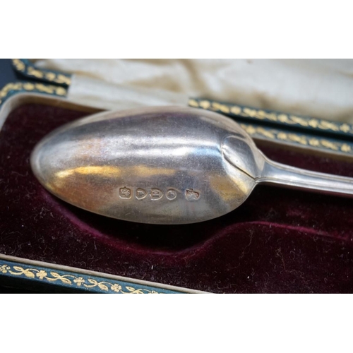 645 - A cased silver christening fork and spoon; together with a cased silver christening spoon; and anoth... 