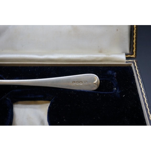 645 - A cased silver christening fork and spoon; together with a cased silver christening spoon; and anoth... 