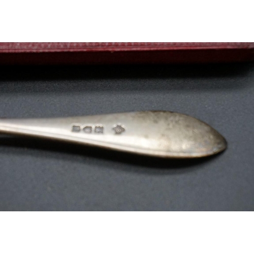 645 - A cased silver christening fork and spoon; together with a cased silver christening spoon; and anoth... 