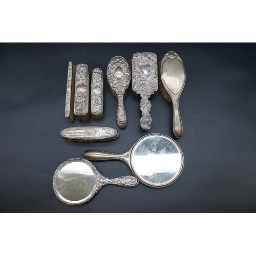 650 - Seven various silver mounted hairbrushes; together with two silver mounted hand mirrors. (9)... 