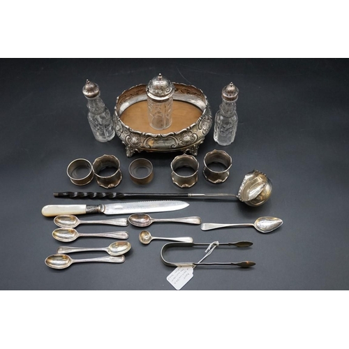 653 - A quantity of silver and silver mounted items; to include five various silver napkin rings; and a ba... 