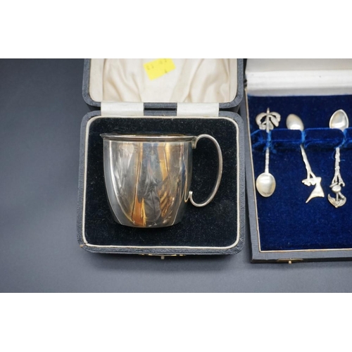 655 - A cased silver mug, by William Suckling Ltd, Birmingham 1932, 6.5cm, 75.8g, together with a cased se... 