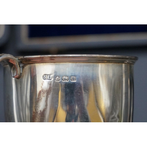 655 - A cased silver mug, by William Suckling Ltd, Birmingham 1932, 6.5cm, 75.8g, together with a cased se... 