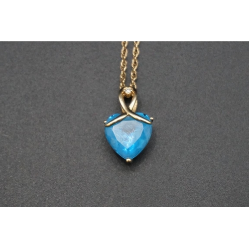 673 - A yellow metal pendant, set heart shaped blue topaz, approx 9ct and a brilliant cut diamond approx 0... 