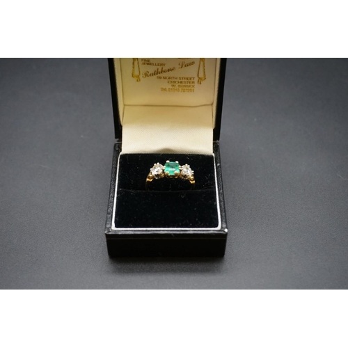 684 - A yellow metal emerald doublet and diamond three stone ring, stamped 18ct, size O.