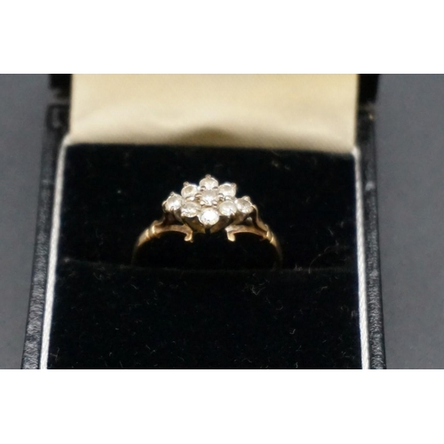 685 - A 9ct gold cluster ring, set nine brilliant cut diamonds, size P.