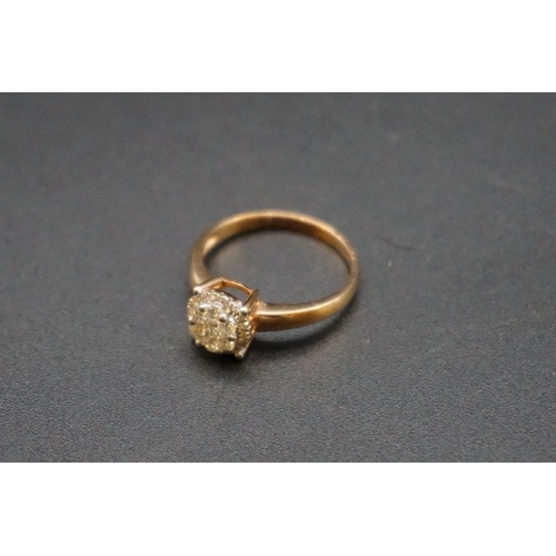 686 - A yellow metal diamond cluster ring, stamped 750, size O.