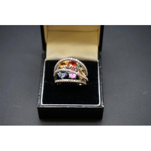 692 - A 14ct white gold gem set cocktail ring, size P., gross weight 10.5g.