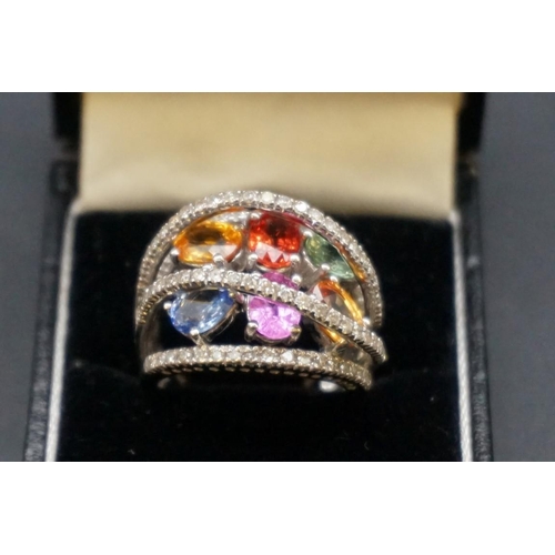 692 - A 14ct white gold gem set cocktail ring, size P., gross weight 10.5g.