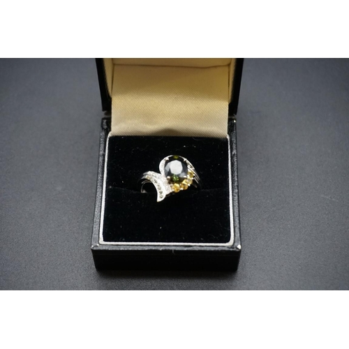 698 - A 14ct white gold ring set diamonds and coloured gemstones, size O.