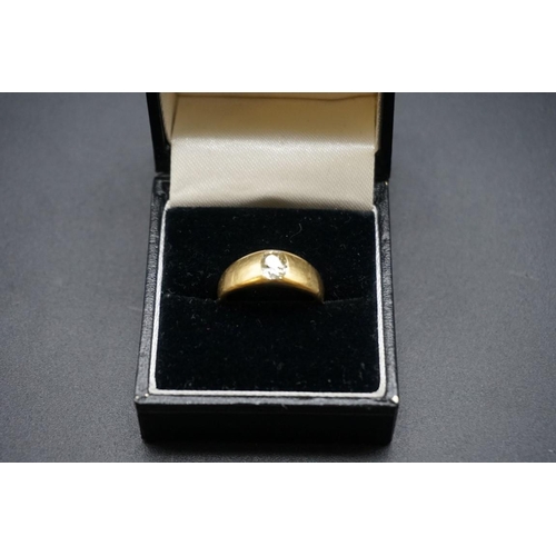 708 - A yellow metal signet ring set old cut diamond, stamped 18, size L1/2,