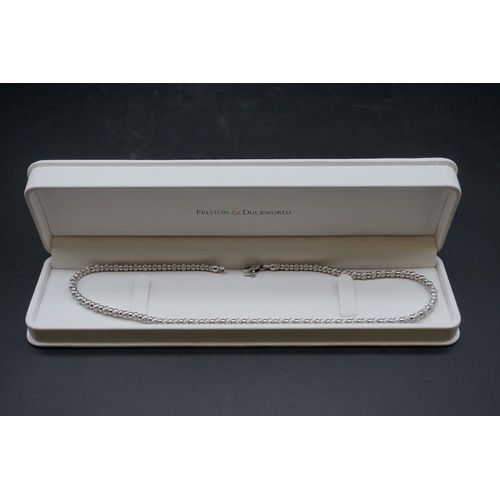 712 - An Italian white metal necklace, stamped 750, by Zancan, approximately 40cm long.