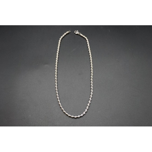 712 - An Italian white metal necklace, stamped 750, by Zancan, approximately 40cm long.