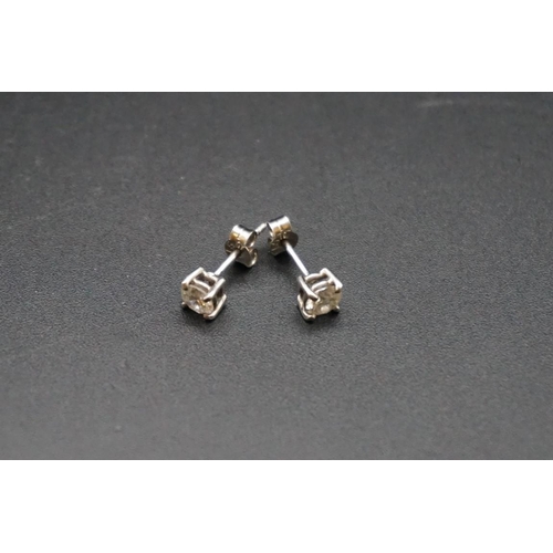 714 - A pair of brilliant cut diamond ear studs, estimated at 0.35ct each.