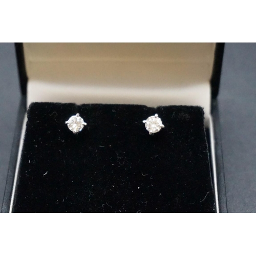 714 - A pair of brilliant cut diamond ear studs, estimated at 0.35ct each.