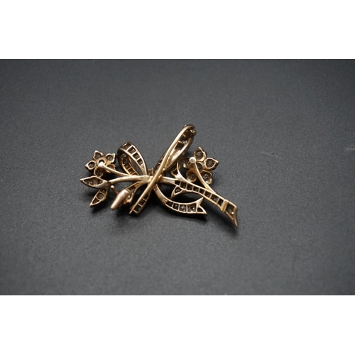 720 - A yellow and white metal diamond set floral spray brooch, 43mm.