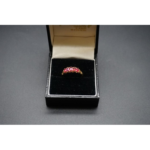 726 - A yellow metal ruby five stone ring, size L1/2.