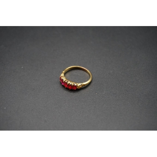 726 - A yellow metal ruby five stone ring, size L1/2.