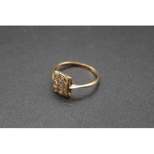 734 - A circa 1900 diamond cluster ring, stamped 18ct, size H.