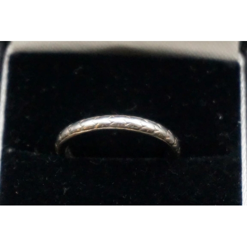 736 - A wedding band, stamped platinum, size M.