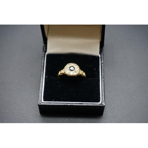 737 - An 18ct gold sapphire and diamond floral cluster ring, hallmark London 1928, size O1/2.... 