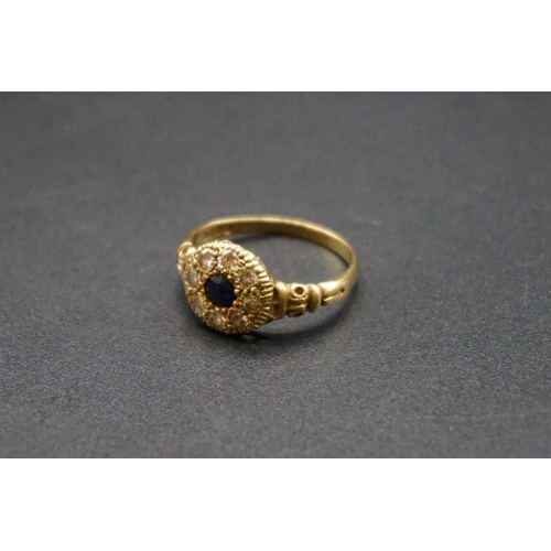 737 - An 18ct gold sapphire and diamond floral cluster ring, hallmark London 1928, size O1/2.... 