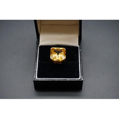 740 - A yellow metal citrine ring, size F.