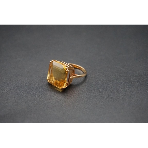 740 - A yellow metal citrine ring, size F.