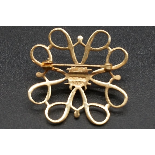 747 - Two 9ct gold openwork floral brooches, one set a diamond to centre and the other set a sapphire to c... 