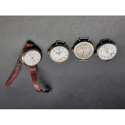 972 - Three various WWI silver manual wind trench watches; together with another silver wristwatch. (4)... 