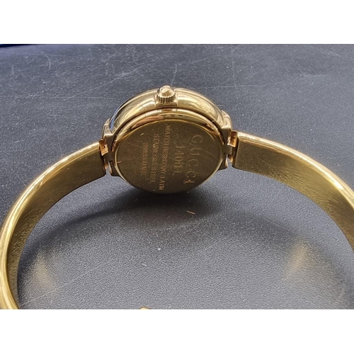 984 - A 1990s Gucci gold tone stainless steel quartz ladies bangle watch, 25mm, Ref. 1400L, Serial no. 012... 