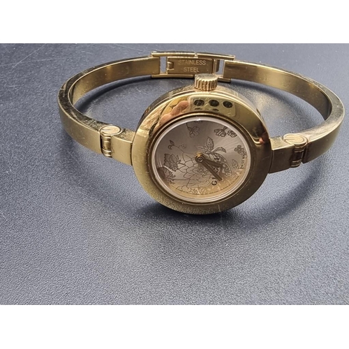 985 - A circa 2009 Gucci 105 gold plated ladies quartz wristwatch, 26mm.