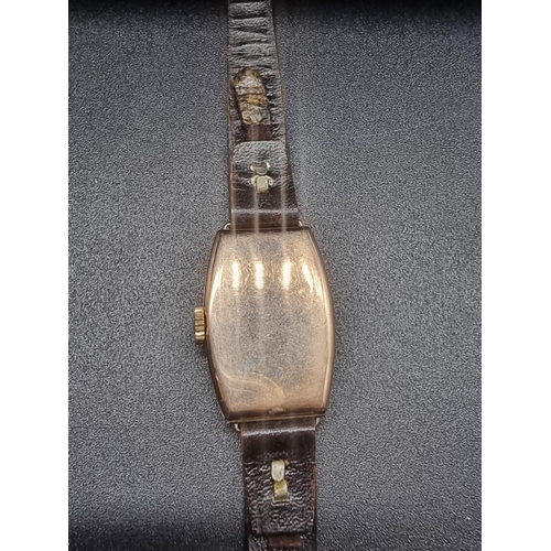 997 - An Art Deco 9ct gold hand wind ladies tonneau wristwatch, 17mm, Swiss movement, London 1930, on late... 