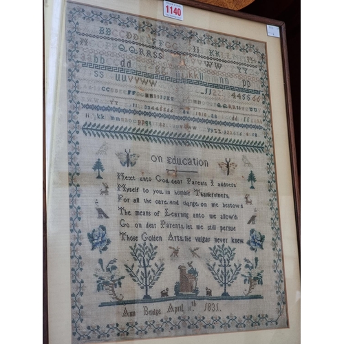 1140 - A William IV needlework sampler, by 'Ann Bridge, April 11th, 1831', 40.5 x 32cm, (moth damage).... 