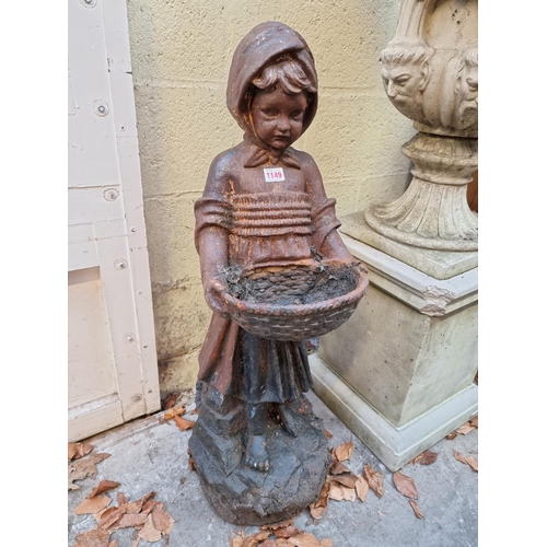 1149 - An old cast iron figure of a Dutch girl, 90cm high. 