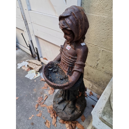 1149 - An old cast iron figure of a Dutch girl, 90cm high. 