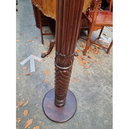 1158 - A carved mahogany 'bedpost' torchere, 102cm high. 