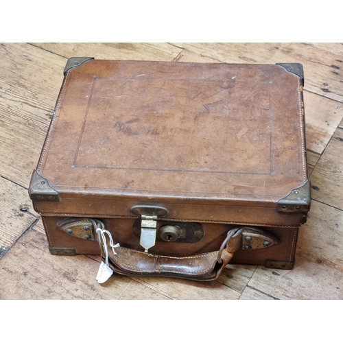 1701 - An old tan leather and brass bound cartridge case, (now with void interior), 33cm wide. ... 