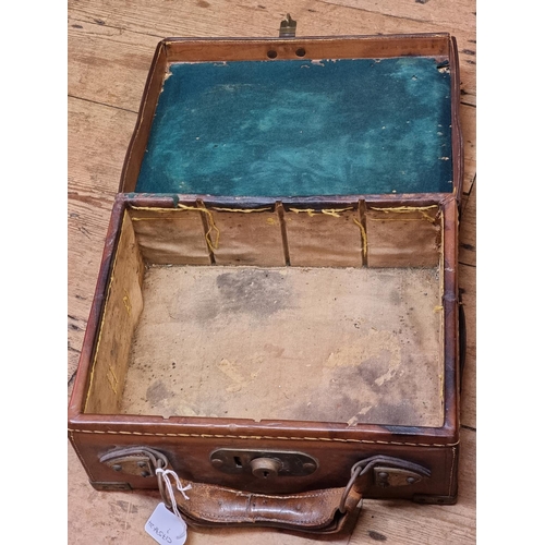 1701 - An old tan leather and brass bound cartridge case, (now with void interior), 33cm wide. ... 